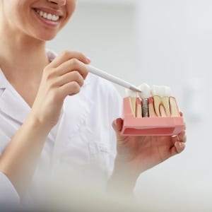 dentist pointing to a dental equipment